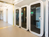 Soundproof phone booth cost with built-in lighting and workspace table