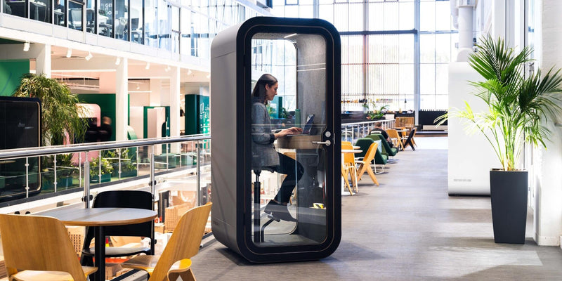 Lady doing a video call in a office pod